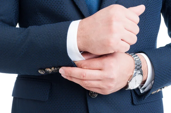 Businessman fixing and adjusting white shirt sleeve under blue s — Stock Photo, Image