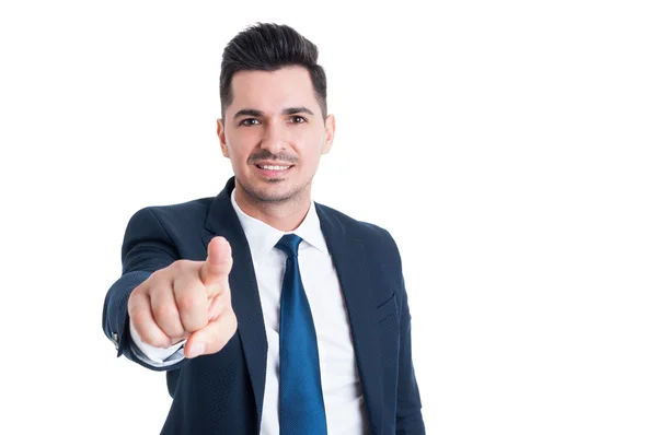 Salesman poiting finger at the camera and smiling — Stock Photo, Image