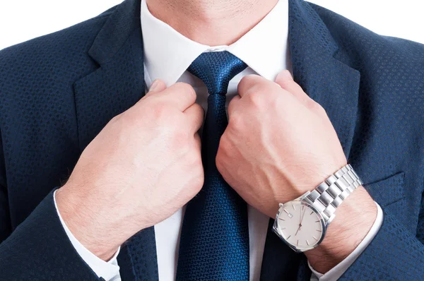 Closeup with businessman necktie fixing white collar — Stock Photo, Image
