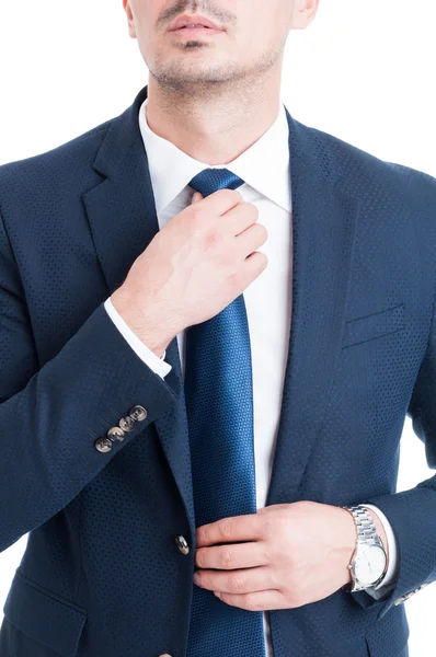 Salesman or broker fixing and adjusting his blue necktie concept — Stock Photo, Image