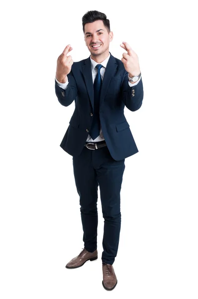 Salesman or businessman making good luck gesture — Stock Photo, Image