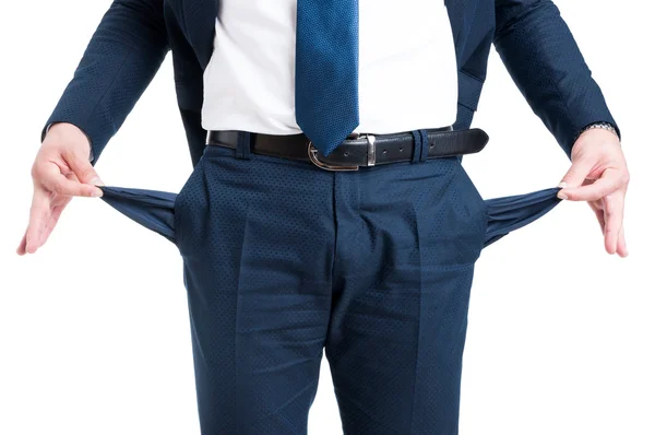 Poor businessman showing empty pants pockets — Stock Photo, Image