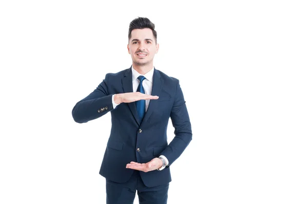 Smiling business man holding copy space with hands — Stock Photo, Image