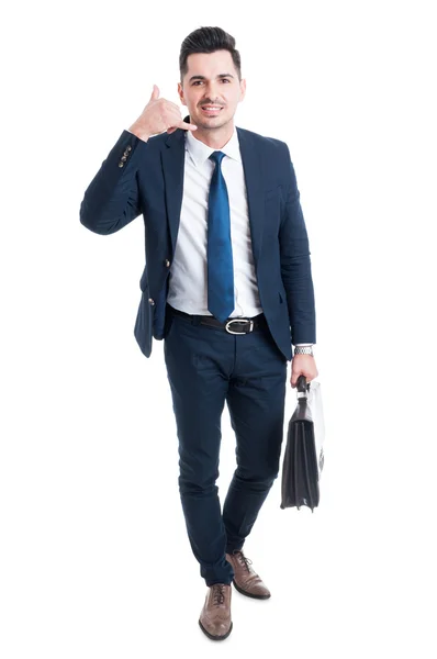 Standing salesman making call me gesture — Stock Photo, Image