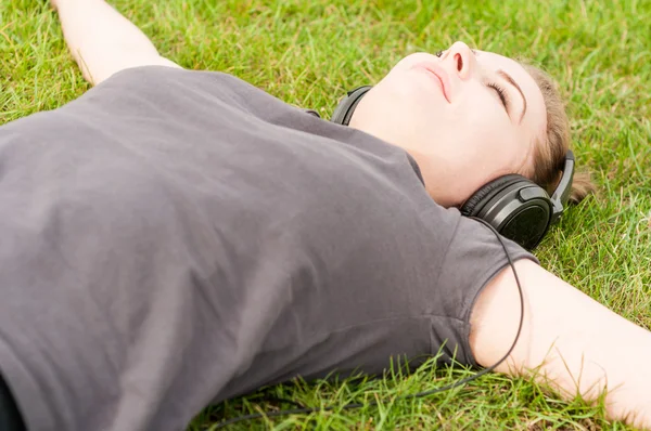 Close-up of young woman enjoying music during recreation time