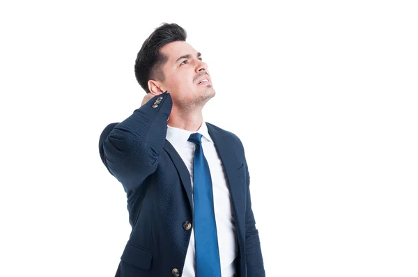 Stressed young businessman suffering from neck or cervical pain — Stock Photo, Image
