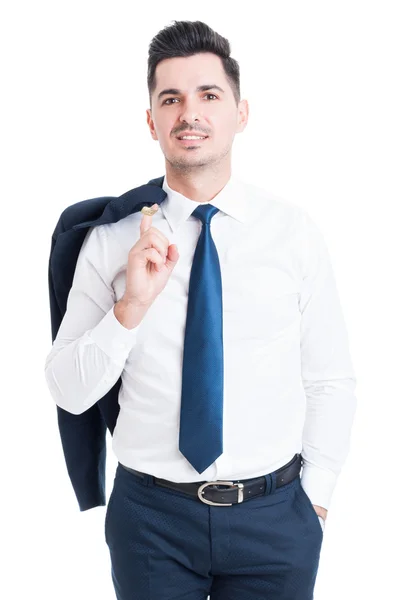 Confident handsome businessman holding his jacket and smiling — Stock Photo, Image