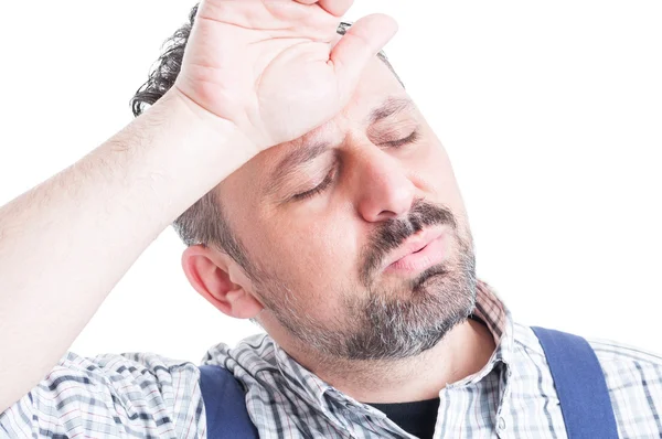 Close-up portrait of young mechanic sweating and looking tired — Stock Photo, Image