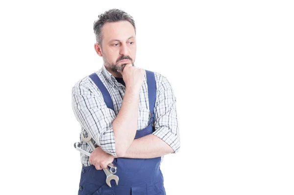 Thoughtful man portrait with young mechanic looking worried — Stock Photo, Image