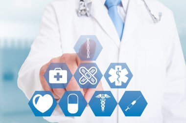 Young doctor hand working with modern medical icons or symbols