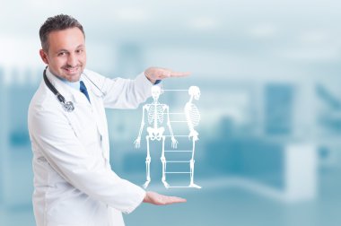 Handsome orthopedist doctor holding skeleton model hologram on h clipart