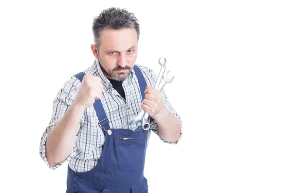 Angry young mechanic being ready for a fight — Stock Photo, Image