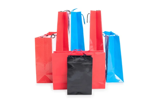 Асортиментні кольорові сумки для покупок включали червоний, синій і чорний — стокове фото