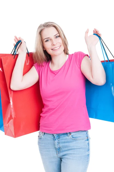 Portrait of joyful female model holding shopping bags — Stock Photo, Image