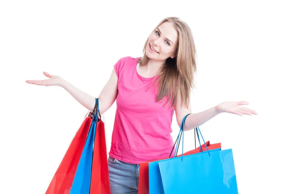 Kobieta z kolorowe torby na zakupy działających wesoły i uśmiechnięty — Zdjęcie stockowe