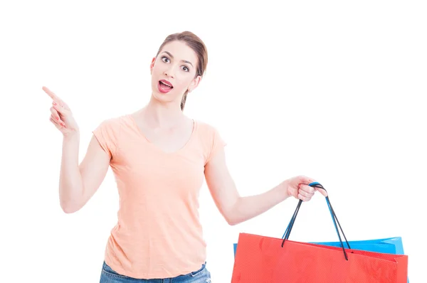 Young lady customer having great idea and holding shopping bags — ストック写真