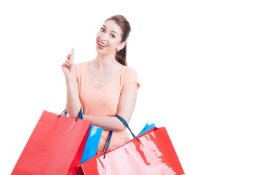Young woman carrying shopping bags having great idea concept
