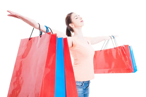 Shopping woman satisfied and happy having arms wide opened conce — Stock Photo, Image