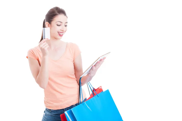 Shopping woman smiling with tablet and credit or debit card — Stock Photo, Image