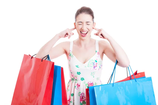 Lady shopper screaming or yelling with ears covered — Stock Photo, Image