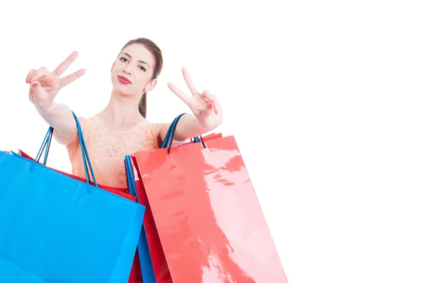 Woman shopper showing victory sign with both hands — Stockfoto