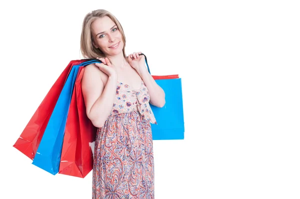 Fashion portrait of cheerful young woman holding shopping bags — Stock Photo, Image