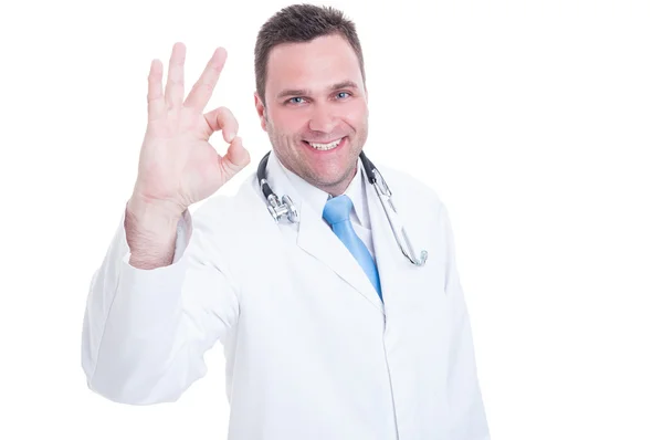 Young doctor or medic feeling positive and showing okay gesture — Stock Photo, Image