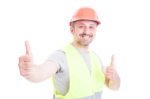 Glada leende konstruktor eller builder visar dubbel som tecken — Stockfoto