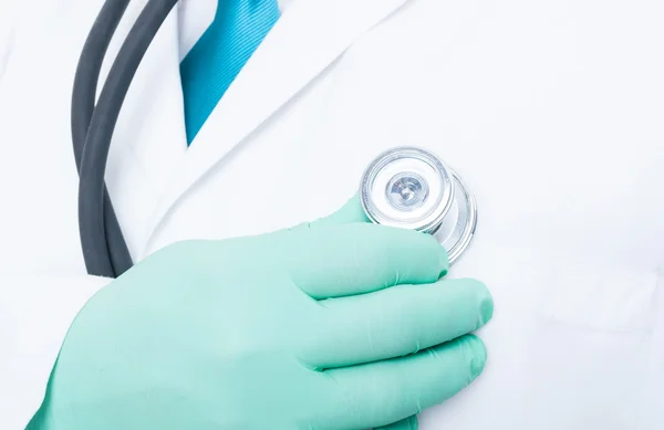 Close-up of hand with  stethoscope on heart — Stock Photo, Image