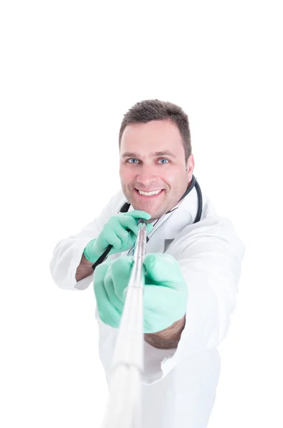 Male doctor taking picture with selfie stick — Stock Photo, Image