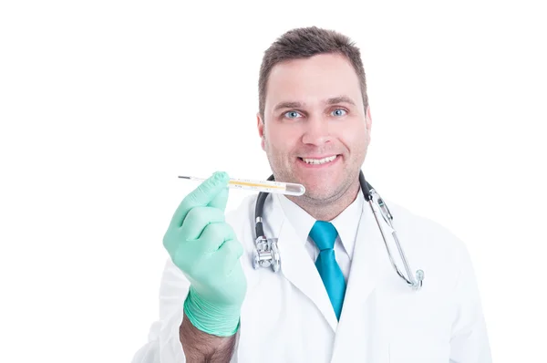 Male pediatrician smiling holding thermometer in hand — Stock Photo, Image