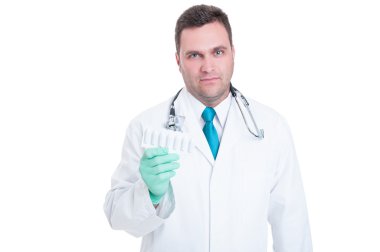 Male medic feeling uncomfortable about suppositories blister clipart