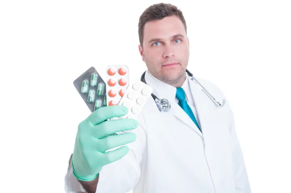 Male medic showing handful of blisters — Stock Photo, Image