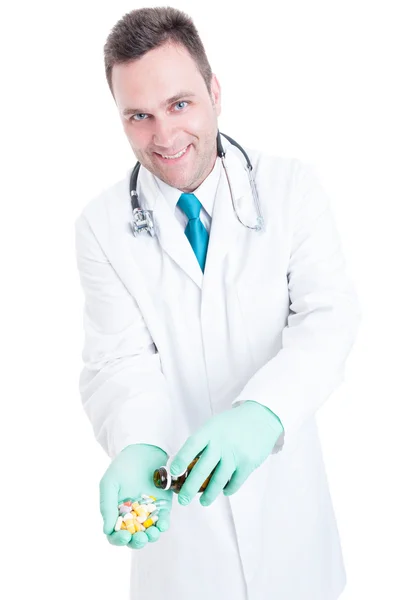 Male pharmacist offering a bottle of pills — Stock Photo, Image