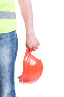 Bir emanet hardhat tutan genç Oluşturucu el