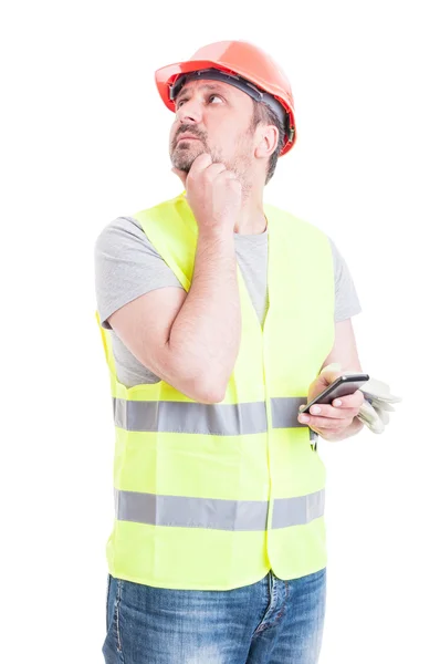 Pensive builder searching for solution at work — Stock Photo, Image