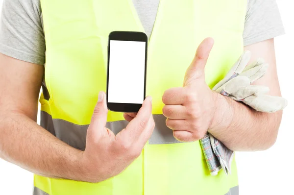 Male builder doing thumbup and show smartphone — Stock Photo, Image