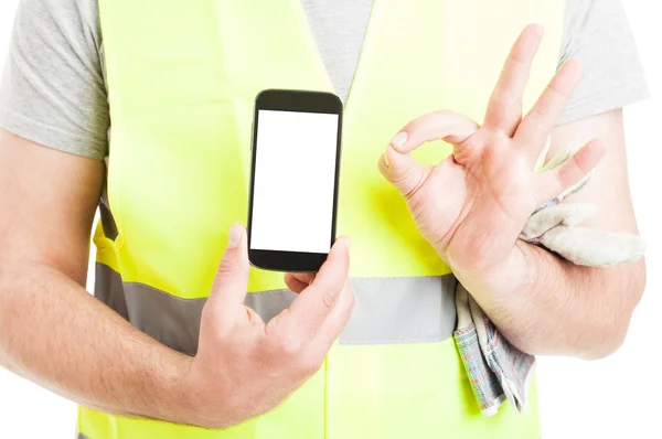 Successful constructor with mobile phone doing ok gesture — Stock Photo, Image