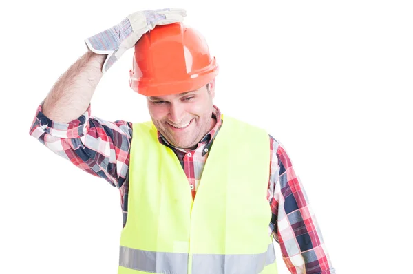 Glücklicher Bauarbeiter hält Hand am Helm — Stockfoto