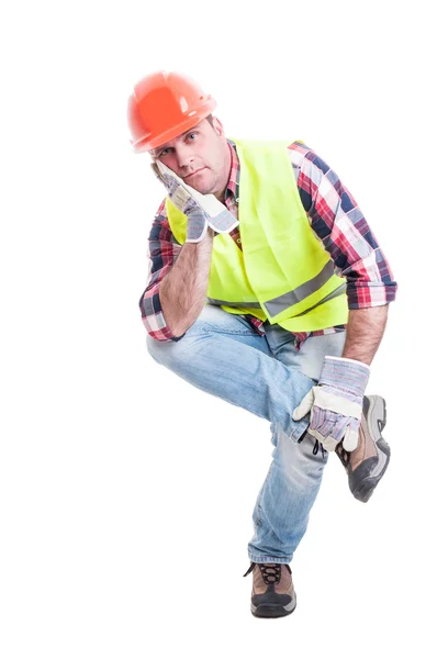 Thoughtful constructor sitting on something and looking dissapoi — Stock Photo, Image