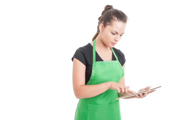 Young supermarket worker searching something on tablet — Stock Photo, Image