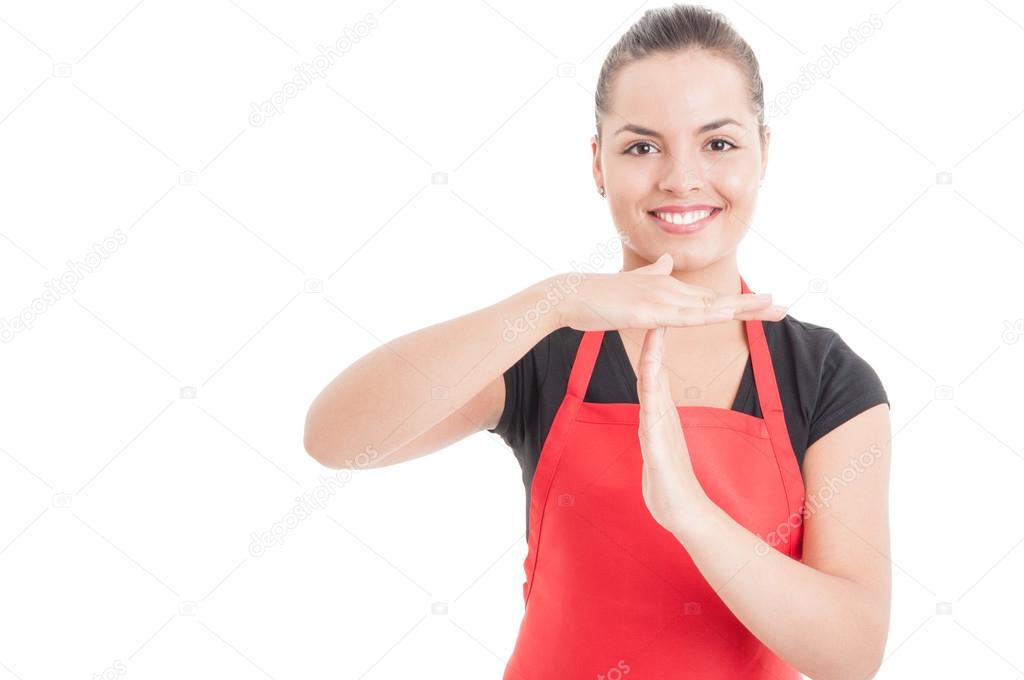 Portrait of female employee doing timeout gesture 