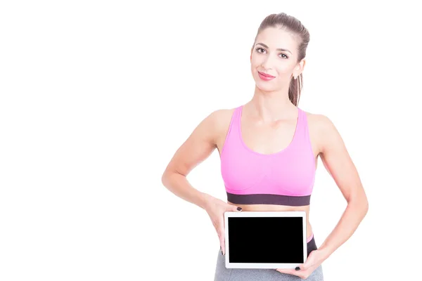 Fit menina vestindo esporte desgaste segurando tablet — Fotografia de Stock