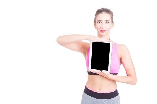 Ženské držení tabletu na sobě růžový korzet a stehna — Stock fotografie