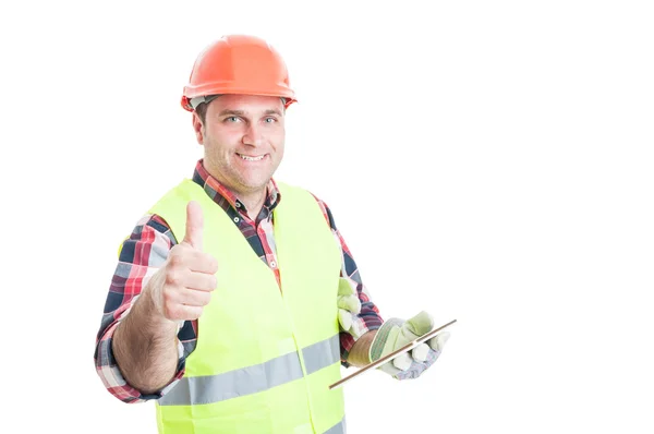 Happy builder holding tablet and showing thumbup Stock Picture