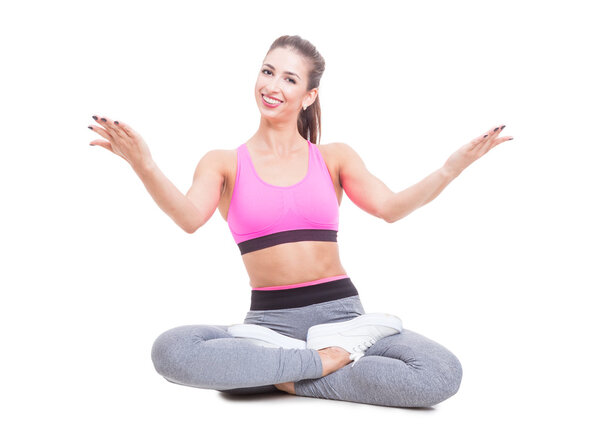 Lady sitting in yoga position with legs crossed