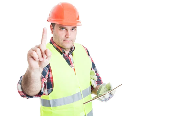Construtor masculino com tablet fazendo um gesto de espera — Fotografia de Stock