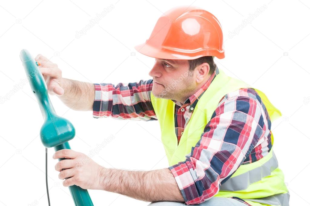 Workman fixing the grass trimming machine