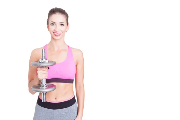 Hembra sosteniendo derecho uno pesado dumbbell — Foto de Stock