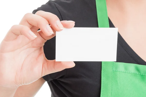 Closeup of business card in hypermarket employee hand — Stock Photo, Image